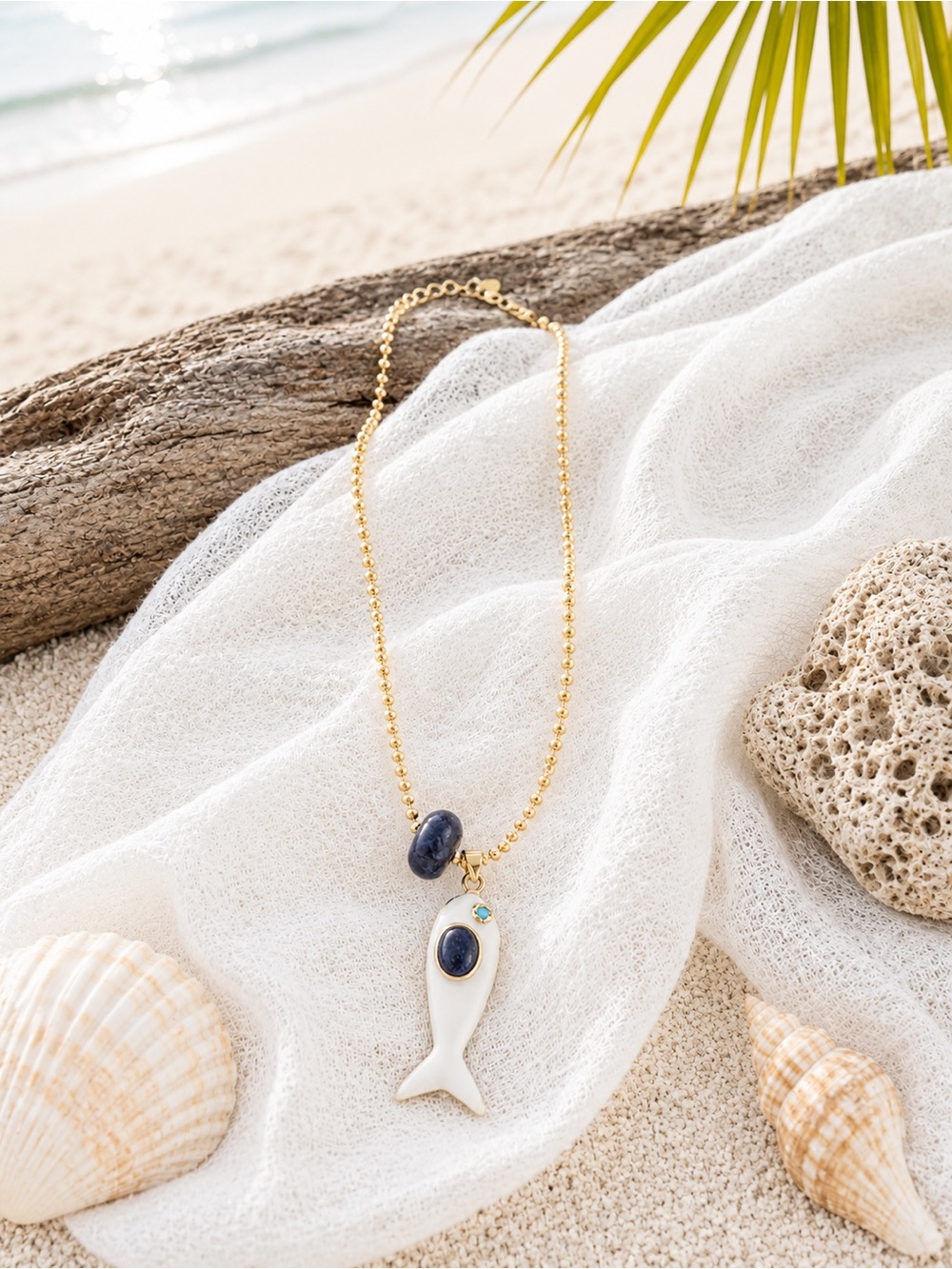 Gold Bead Necklace with Blue Stone and White Fish Pendant